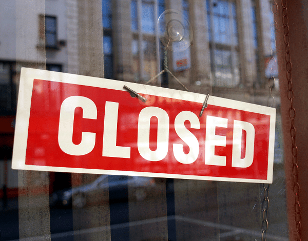 Sign indicating a business is closed after being breached by a cyberattack