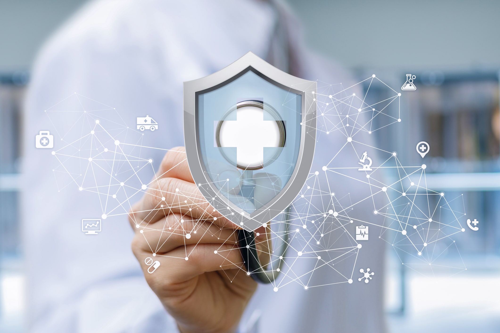 Shield with a medical cross hologram in a doctor's hand, surrounded by health-related icons